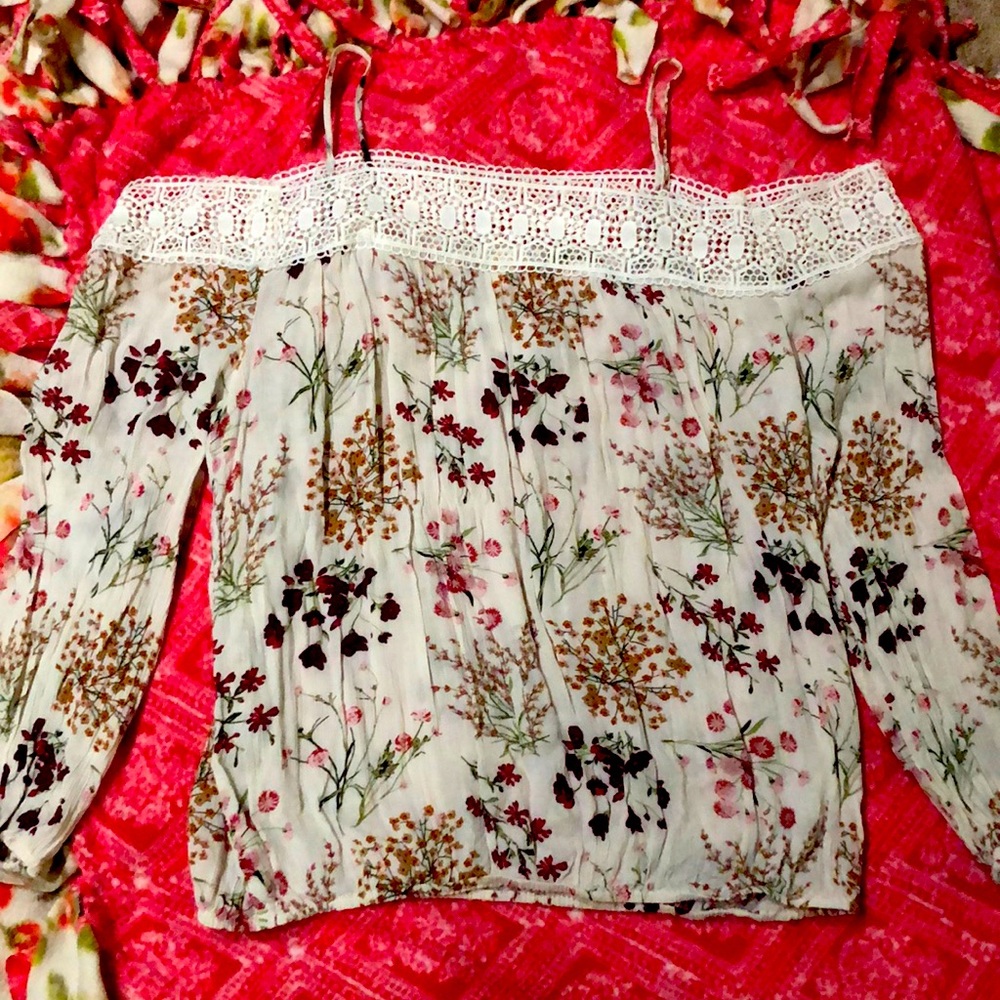A floral off the shoulder blouse with lace trimming